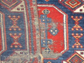 East Anatolian rug fragment, very fine weave and saturated natural color. An exceptionally elegant but battered older example of an iconic type.           