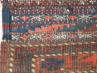 Baluch Minakhani Bagface, saturated colors with all three secondary colors, green, purple and orange, depressed warp type from Khorossan, good shape with bottom kilim, complete sides and intricate flatwoven top. A former  ...