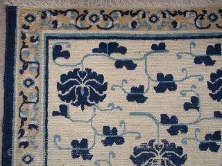 Sweet White-Ground Chinese Ningxia Rug, blue peonies and arabesque with a minimal border. hand-spun cotton warp and weft. very soft wool pile. size is 3'6"x5'7".        