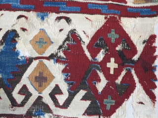 Central Anatolian kilim fragment. long strip with great colors on a white ground. Mounted and conserved.                 