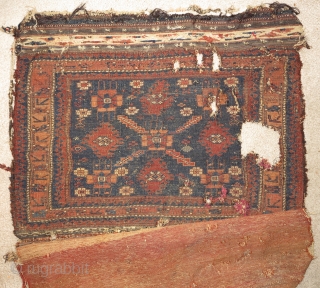 Single-wefted minakhani Baluch bag in paradoxical condition. An old example with several blues, complete back and great flat-woven top but with a lot of damage to the face. The pile face is  ...