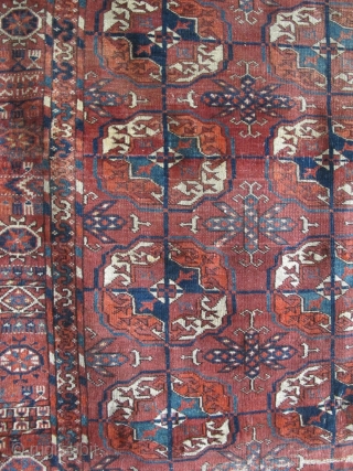 Tekke Long Rug, All colors are good, wool is soft and there are some silk highlights. Complete but with areas of wear and a stain at the very top. Older than most  ...