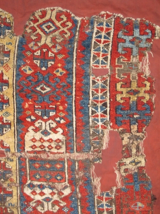 East Anatolian Kurdish rug fragment. Super vibrant madder. mounted and conserved.                      