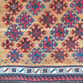 Small camel ground Baluch rug with floating diagonal elements excellently spaced, rustic construction with camel, wool and brindled warp, striped kilim on both ends. distinct band if abrash towards the bottom of  ...