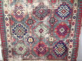 Moghan with Memling Guls, First Half 19th century, great color including at least two reds, three blues, purple, etc. cotton in the wefting. Obvious condition issues, uncommon beauty and power despite.  