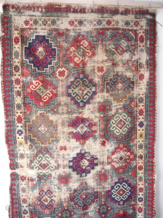 Moghan with Memling Guls, First Half 19th century, great color including at least two reds, three blues, purple, etc. cotton in the wefting. Obvious condition issues, uncommon beauty and power despite.  