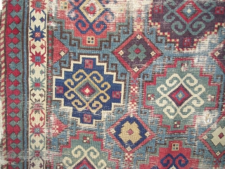 Moghan with Memling Guls, First Half 19th century, great color including at least two reds, three blues, purple, etc. cotton in the wefting. Obvious condition issues, uncommon beauty and power despite.  