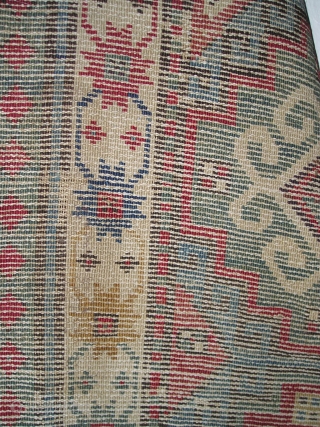 Moghan with Memling Guls, First Half 19th century, great color including at least two reds, three blues, purple, etc. cotton in the wefting. Obvious condition issues, uncommon beauty and power despite.  