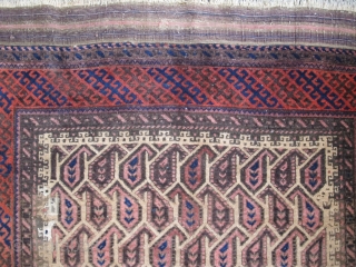 Larger than normal Baluch rug with unusual geometric botehs arranged in a subtle but sophisticated repeat creating graphic diagonal negative space that works very well with the diagonal latch-hook striped border. The  ...