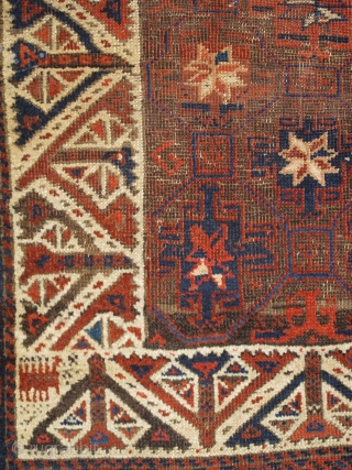 Khorosan Baluch Rug with Memling Guls arranged within a lattice. Abstracted trees are alternated throughout the ivory-ground border. Very nice example of a familiar but uncommon type.      