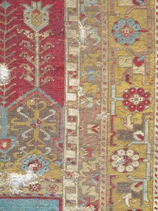 Ladik Prayer Rug, late 18th century, severely fragmented in two sections, dynamic drawing with many stylized ewers, very dirty and damaged but with a vibrant and uncommon gold border, recently found in  ...