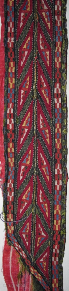 Tekke Turkmen embroidered band. Very fine. Very colorful with several blues, yellow, orange and insect red. Embroidered on a hand-woven green silk. 105x6cm          