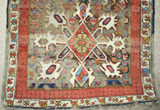 Starburst Caucasian Zeichur rug with a dark corroded ground, very colorful with a sculptural effect.                  