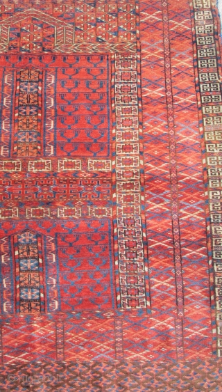 Tekke Ensi, some silk highlights, interesting sainak formation, area of repair in bottom left border. Flashy color including a light blue and insect red. Velvety pile.       