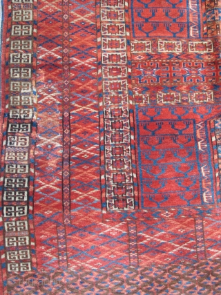 Tekke Ensi, some silk highlights, interesting sainak formation, area of repair in bottom left border. Flashy color including a light blue and insect red. Velvety pile.       