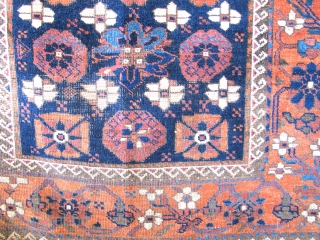 Khorossan Baluch Minakhani Rug with Open Blossoms. This is an uncommon variant seen most frequently on earlier minakhani Baluch carpets. This piece was woven with depressed warps, natural colors including aubergine and  ...