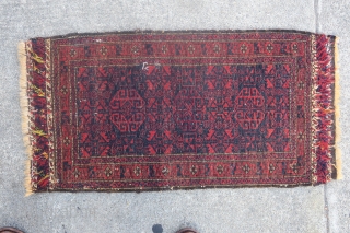 Baluch balisht with radiant reds and glossy wool. Silk highlights in the flatwoven ends. Cochineal used as abrash in the central geometric ornament.          