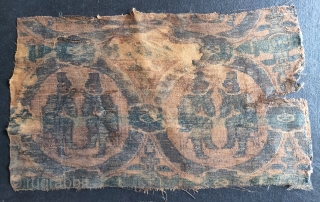6th- 7th century silk warp-faced textile fragment in the 'International Style' depicting seated Central Asian or Iranian merchants within roundels ornamented with pearls. 
 This warp-faced structure pre-dates the weft-faced samite silks  ...