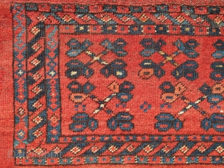 Ersari Trapping, great vibrant madder red. The top row of ornament is drawn on a smaller scale while the bottom is larger-scale spaced more openly. This contrast in composition is further highlighted  ...