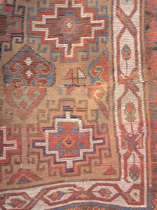 Northwest Persian Rug, Kurdish or maybe Shahsevan? Memling gul design on camel ground with great colors. The whites towards the bottom are cotton. The piece is cut and shut but the resulting  ...