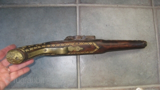 Antique decorated pistol from Tribal area of Pakistan. 18 inches long.  Wood and metal inlaid with bone.  Brass plate on barrel. Purchased in 1960's in NWFP, Pakistan.    