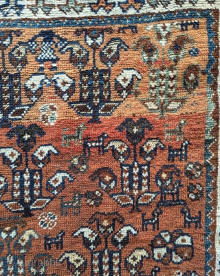 Luri small rug. 36" x 48".  Rustic, very improvisational field filled with floral and animal forms on a copper ground. Even wear to center, end losses.  Good little decorative piece  ...