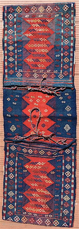 Antique Shahsavan complete khorjin.  18 inches wide, overall length about 51 inches (46 cm x 130 cm).  Circa 1900 .  Balanced plainweave with designs in extra-weft techniques.    ...