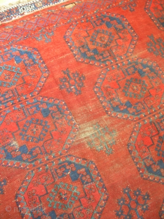 7'4" x 9'6" old ersari rug, with some nice open space and colors, but also a second red that's not all natural, some wear areas, and one 4" x 1.5" little cut  ...