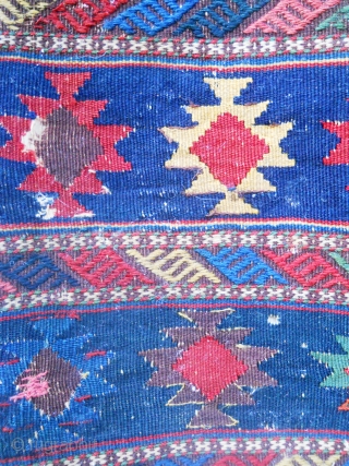 Kilim panel as found condition with some small holes.  Saturated color and design.                   