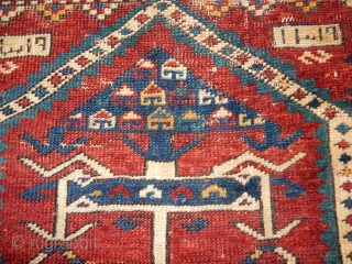 KAZAK OR KUBA RUG WITH BLUE SIDES , THIN RED WEFTS , AND BRAIDED ENDS ...DATED 1898
A BIT OF WEAR- 40 X 60 INCHES         