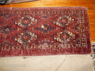 BOYLSTON ASSOCIATES ANTIQUE CAUCASIAN RUGS .COM 
TEKKE TORBA CIRCA 1870 DECENT PILE WITH SOME WEAR BUT WITH THE COMLETE BACK 
TWO HORNS ON EACH ANIMAL HEAD , NICE OLDEST INDIGO DYE USED
MAYBE  ...