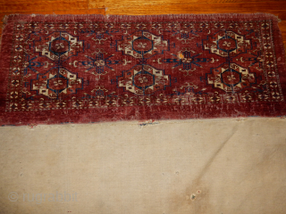 BOYLSTON ASSOCIATES ANTIQUE CAUCASIAN RUGS .COM 
TEKKE TORBA CIRCA 1870 DECENT PILE WITH SOME WEAR BUT WITH THE COMLETE BACK 
TWO HORNS ON EACH ANIMAL HEAD , NICE OLDEST INDIGO DYE USED
MAYBE  ...