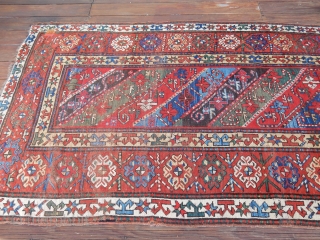 DECORATIVE KAZAK/GENJE CARPET WITH GOOD SIDES AND A BIT OF END LOSS - SIZE IS    4 FT X 9  1/2 FT -   PRICE - $700  