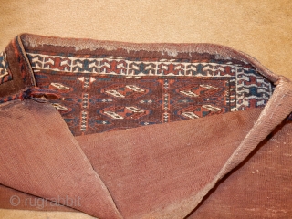 SMALL YOMUT YOMUD MAFRASH WITH FULL PILE- ALL NATURAL DYES - A CARAVAN OF CAMELS ACROSS THE BOTTOM AND THE ORIGIAL BACK STILL ATTACHED . PRICED AT $33 PER CAMEL - $775. 