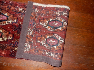 old  antique tekke torba with excellent+ pile - sold years ago in this catalog by a noted english dealer - corroded rose silk centers -       