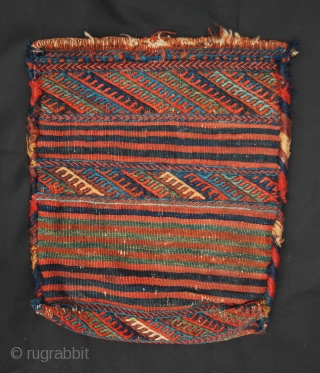 This rare and charming little flatwoven spindle-bag was made by Sanjabi-Kurds during the 19th century. It is in excellent condition and measures 43cm x 36cm (1' 5" x 1' 2").   