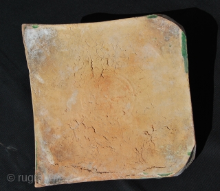 According to a couple of professional statements this is a 14th century Ilkhanid period (1256/1335) Green Glazed Reliefed ceramic tile 
Cm 22x22 with height of 2 to 6 cm. From either Iran  ...