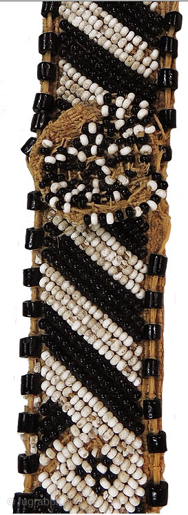 AFRICA!
Kuba people beaded headband - Congo. Mid 20th century or earlier. Cm 73x3 ca. Raffia, cowry shells, beads. Such headbands were worn by nobles of Kuba royal families. They were the sign  ...