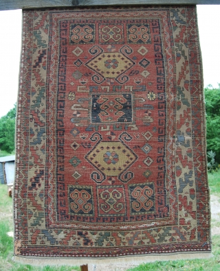 Kozak rug from Bergama area, Western Anatolia. Size is cm 97x137. Early 20th century, so, about 100 years old if not more. Low pile, one old, clearly visible restoration. Interesting pattern, great  ...