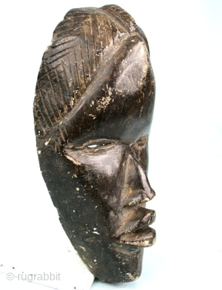 African Art.
Dan mask, carved in stone.
The mask has a shape of a "runner mask", but such items are sacred and not dedicated to run.
Item of great quality, for collectors
Height: 20 x 11,5  ...