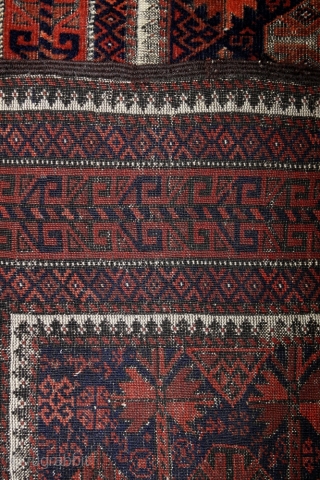 Baluch Timuri, a so called Sangtshuli; about 1880; 105 x 186cm (3`5”x 6`1”) rare seen main border (not found comparable border in Baluch rug books), like a row/chain of triangle amulets (an  ...