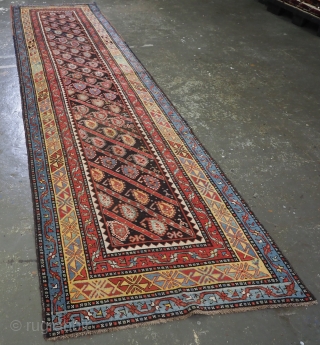 Antique Caucasian Karabagh region runner with all over diagonal boteh design.
www.knightsantiques.co.uk
Circa 1880.
Size: 14ft 1in x 3ft 5in (430 x 104cm).
A very good runner with diagonal rows of flowering boteh on a charcoal  ...