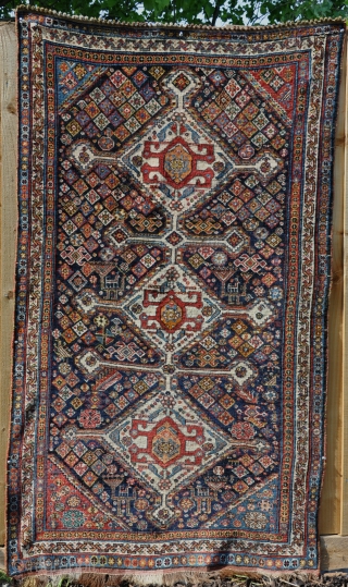 A beautiful antique qasgai rug with a design more commonly found on bigger carpets. Some old, high quality repair, a few lower areas, but generaly in good order. 176 x 101cm  