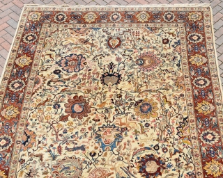 An Old Persian Tabriz carpet of Benlyan type. A highly decorative item with all-over palmetes and hunting animals woven in muted dyes on soft ivory ground. The piece is in excellent, original  ...
