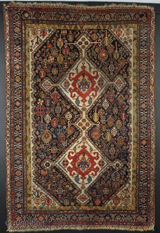 A good antique Qasgai with lovely graphics. Losses to ends, slightly low in places, filthy dirty,but a good old one and a nice size. 208 x 138cm      