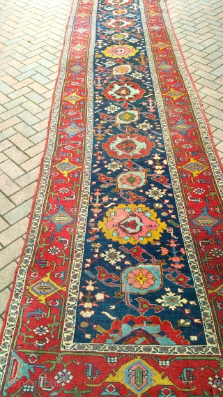 A very large antique Harshang design Bijar runner, mainly in good original condition but with damaged ends. Very heavy! Circa 1880. 18x3'6           