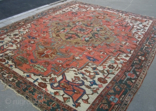 A good Heriz carpet in decent, original condition with very decorative colors. late 19th century. 12'3 x 10'1.               