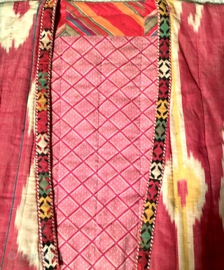 19th century Uzbek Adras Silk wrap/ cotton weft Ikat Chapan ( Coat). Excellent natural colours and bodom gul (almond) design. Beautiful linen, spectacular cross stitches on neck part edges. Reasonable price.   ...