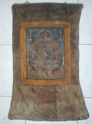 VERY OLD RARE TIBET THANGKA PAINTING: Tibetan Wheel of Life (Bhavacakra).
Tibetan oil painting on canvas of the Wheel of Life commonly seen throughout Tibet and the Himalayas.It illustrates in detail the essence  ...