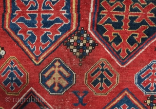 Borchalu Kazak rug, 19th century. Archaic trees inside medallions. There is a headless human figure at the bottom of the rug. Some wear in the center but good pile all around the  ...